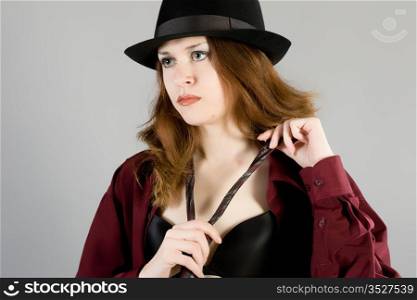Portrait of the long-haired girl in a hat
