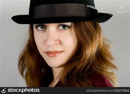 Portrait of the long-haired girl in a hat