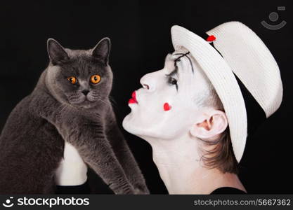 Portrait of the mime with a gray British cat