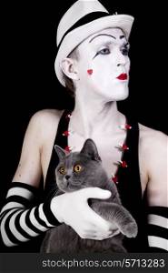 Portrait of the mime with a gray British cat