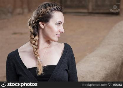 portrait of the pretty brown haired women head and shoulders with braid