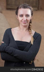 portrait of the pretty brown haired women in black shirt pullover torso vertical shot