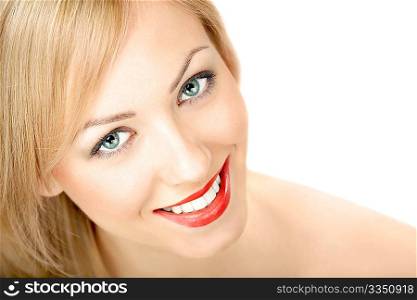 Portrait of the smiling blonde on a white background