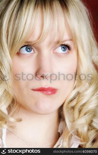 Portrait of the surprised girl with light hair