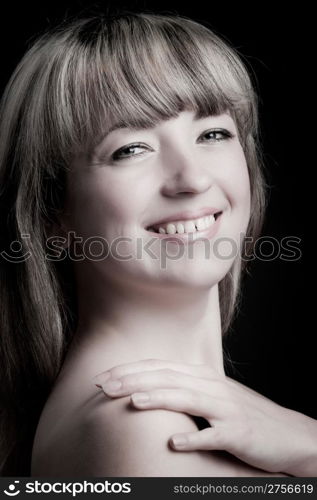 Portrait of the woman close up. The bared shoulders. Toned image.