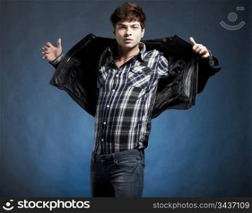 Portrait of the young beautiful man in a jump