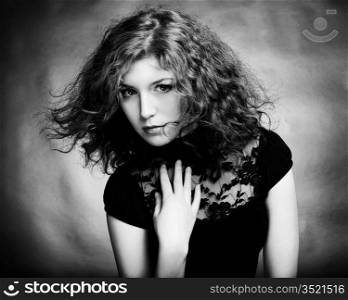 Portrait of the young beautiful woman with curly hairt. Vintage portrait