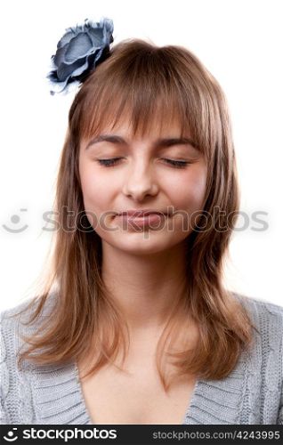 Portrait of the young girl with closed eye on white background