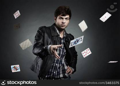 Portrait of the young man playing cards