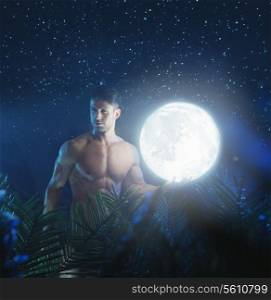 Portrait of the young nude model in the bright night jungle
