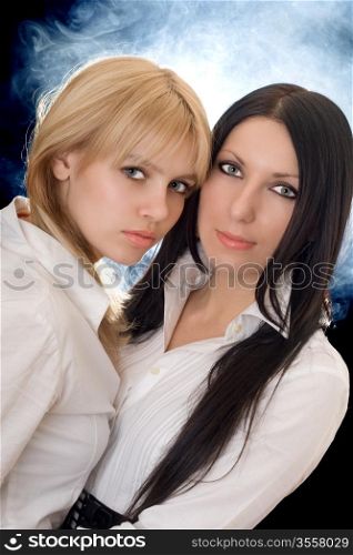 Portrait of the young pretty brunette and blonde