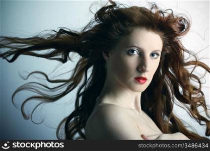 Portrait of the young sexy girl with wavy hair