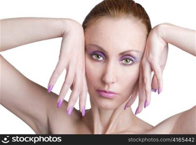 Portrait of the young woman with a make-up in pink tones and with long nails