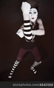 Portrait of theatrical mime on a black background