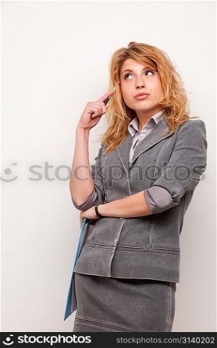 Portrait of thinking woman with pen, isolated on white background