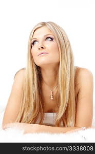 Portrait of thoughtful charming blonde isolated on a white background