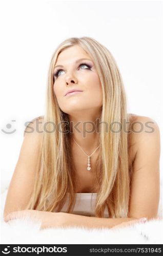 Portrait of thoughtful charming blonde isolated on a white background
