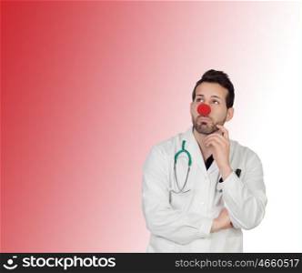 Portrait Of Thoughtful Clown Doctor Isolated Over Coloured Background