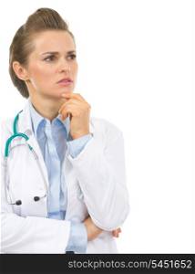 Portrait of thoughtful doctor woman looking on copy space