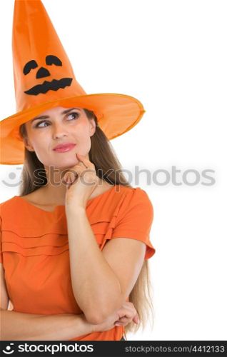 Portrait of thoughtful young woman in Halloween hat