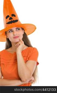 Portrait of thoughtful young woman in Halloween hat
