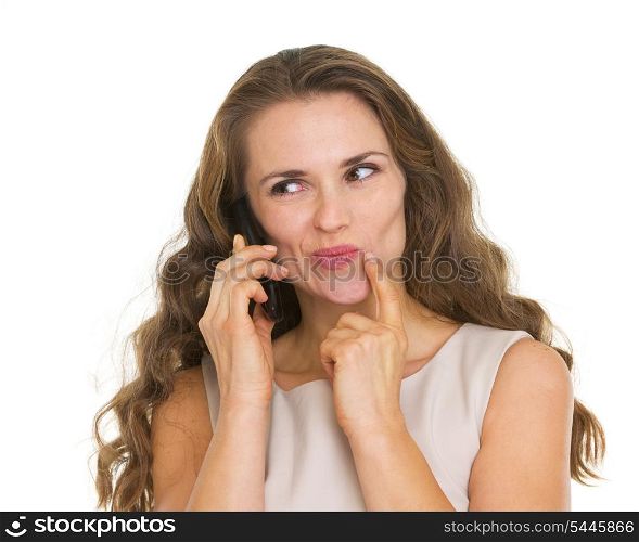 Portrait of thoughtful young woman talking mobile phone