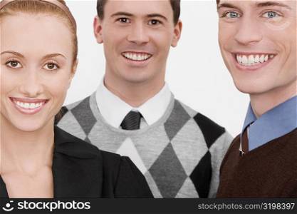 Portrait of three business executives smiling