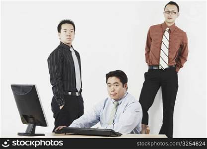 Portrait of three businessmen in an office