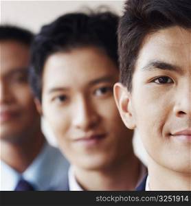 Portrait of three businessmen smiling
