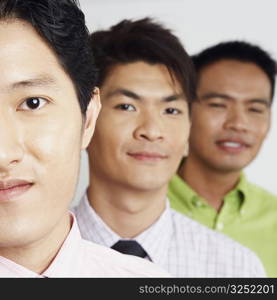 Portrait of three businessmen smiling