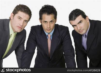 Portrait of three businessmen standing together
