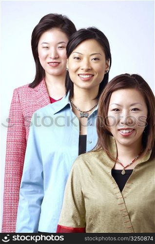 Portrait of three businesswomen standing in a row