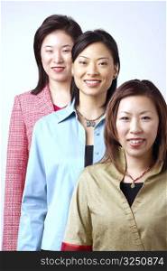 Portrait of three businesswomen standing in a row