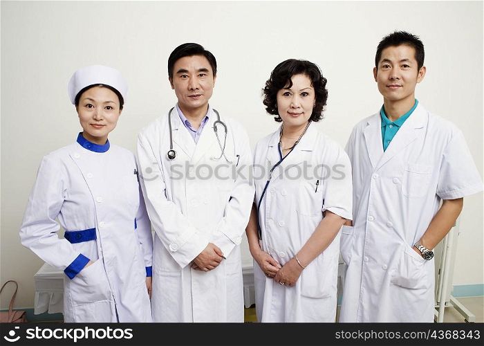 Portrait of three doctors and a nurse