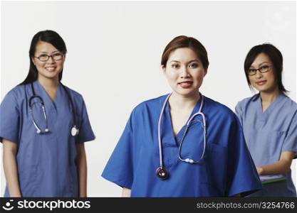 Portrait of three female doctors smiling