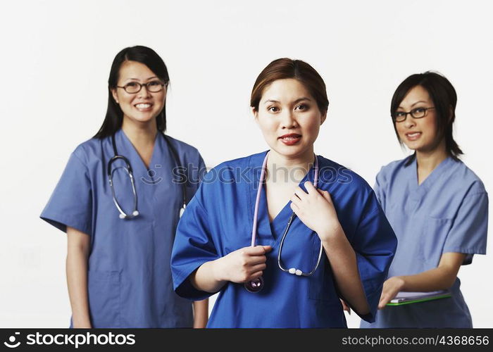 Portrait of three female doctors smiling