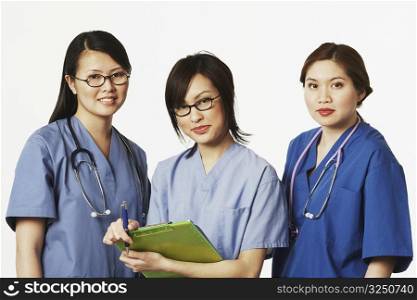 Portrait of three female doctors standing together