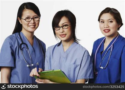 Portrait of three female doctors standing together