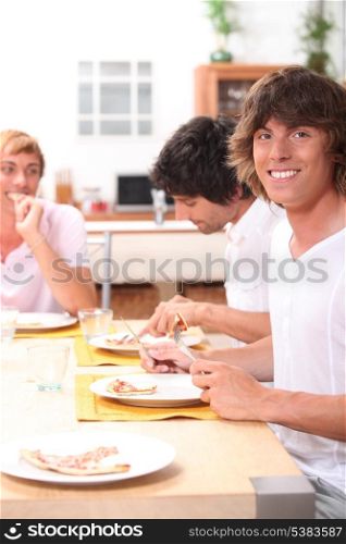portrait of three friends at table