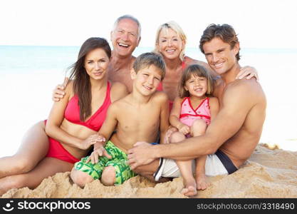 Portrait Of Three Generation Family On Beach Holiday