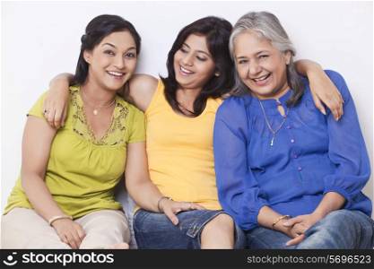 Portrait of three generation family sitting together