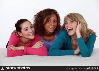 Portrait of three happy girlfriends
