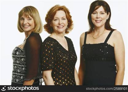 Portrait of three mature women standing together and smiling