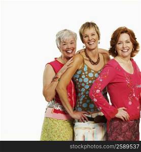 Portrait of three mature women standing together and smiling