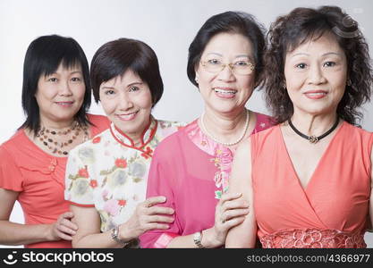 Portrait of three senior women and a mature woman smiling