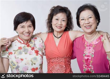 Portrait of three senior women standing together and smiling