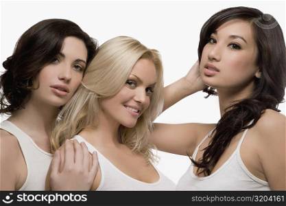 Portrait of three young women posing