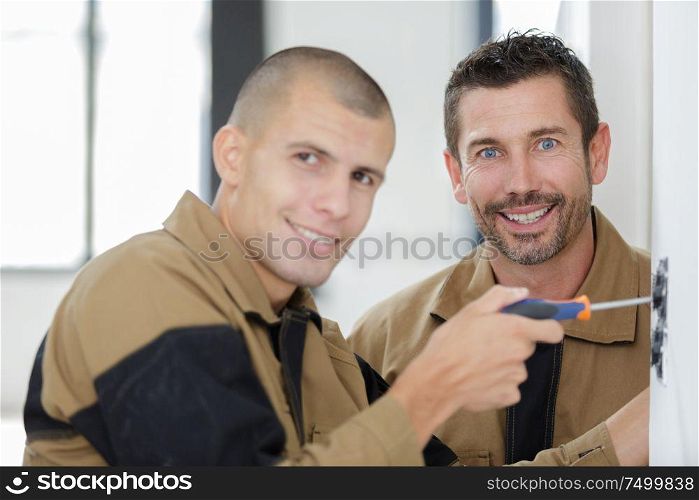 portrait of tradesman with his apprentice