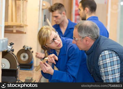 portrait of trainee in wood workshop