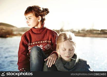 portrait of two beautiful girls in the village, children&acute;s fashion autumn